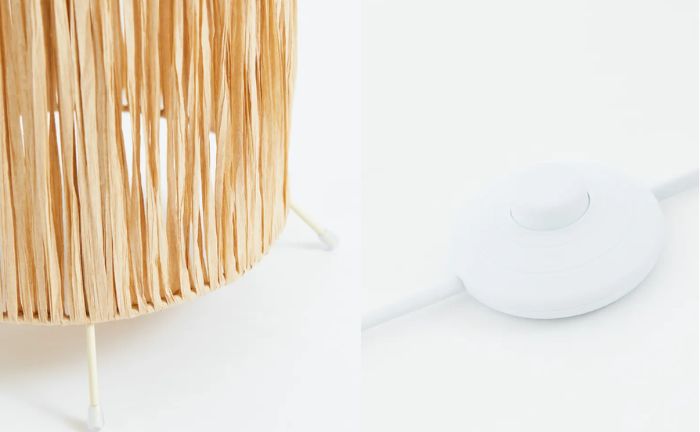 Detalles del tejido y el interruptor de la lámpara de pie con pantalla de paja de papel de H&M Home