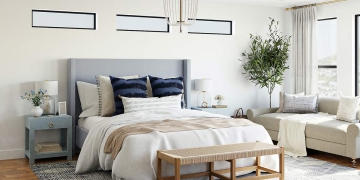 Dormitorio decorado con plaids en cama y sofá