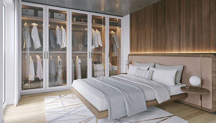 Dormitorio con armario de puertas transparentes
